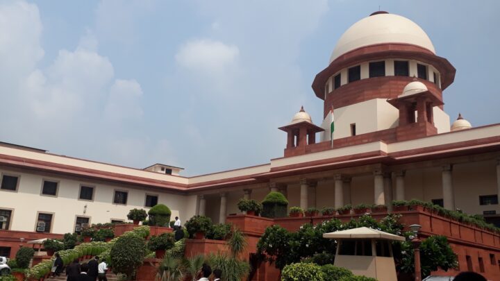 The Supreme Court of India building in New Delhi, its white dome and red sandstone wings, with lawyers in black gowns crossing the forecourt (file photo)