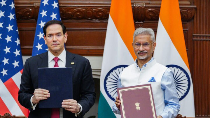US Secretary of State Marco Rubio and External Affairs Minister S Jaishankar hold document folders in front of US and Indian flags