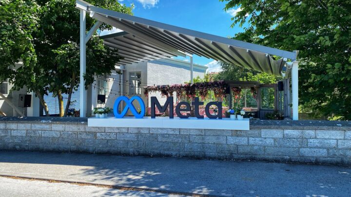 A large outdoor sign with the Meta logo and name.