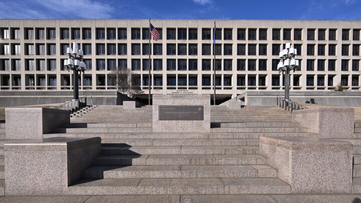 The Frances Perkins Building, headquarters of the US Department of Labor in Washington, DC, with flags and granite steps in front
