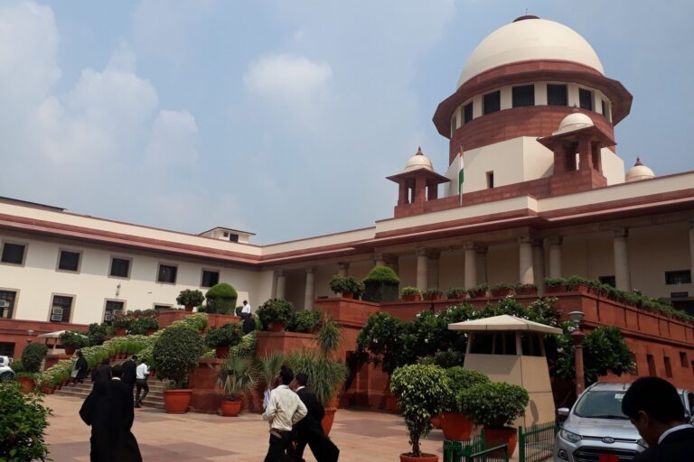 The Supreme Court of India building in New Delhi with its white dome and red sandstone wings