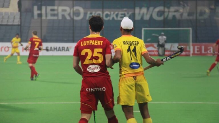 Indian forward Mandeep Singh, wearing No. 11, on a hockey pitch